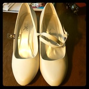 Pair of White *Its Okay* heels